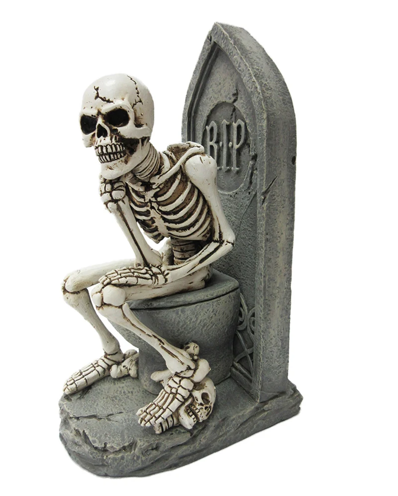 Denkende Skelett Figur auf WC
